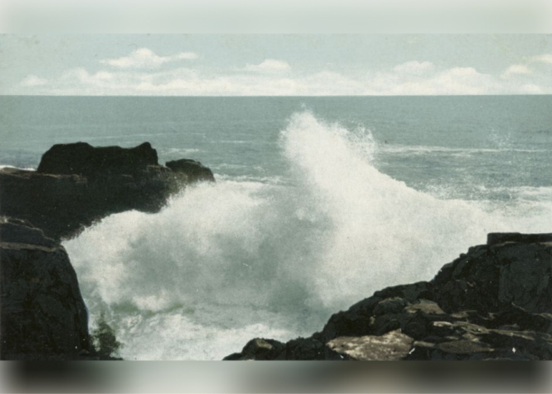 Sea waves crashing against rocks