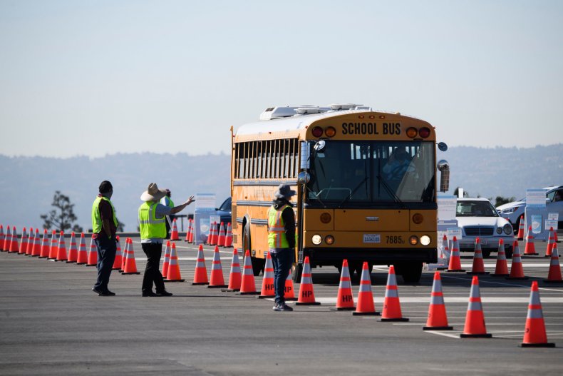 A school bus transporting education workers arrives