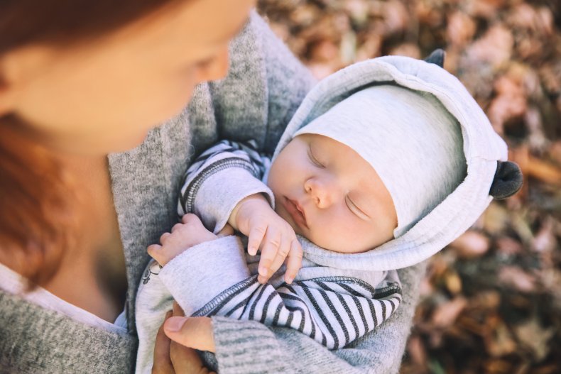 Baby sleeping in arms