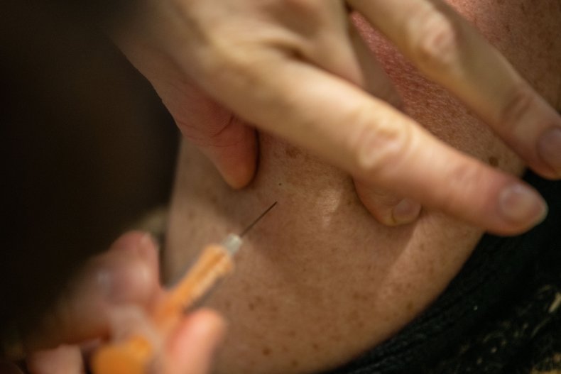 Woman receives the AstraZeneca COVID-19 vaccine