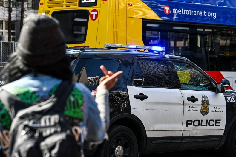 minneapolis police flip off protester