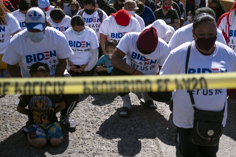 Migrants protest at US-Mexico border Joe Biden