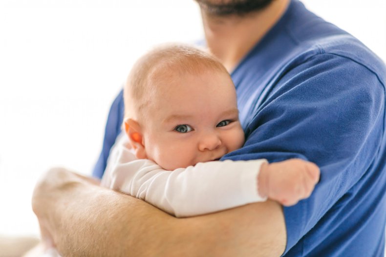 Baby being held