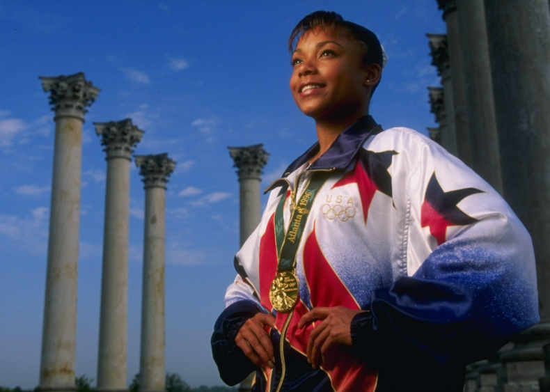 1996: Dominique Dawes wins Olympic medal in gymnastics