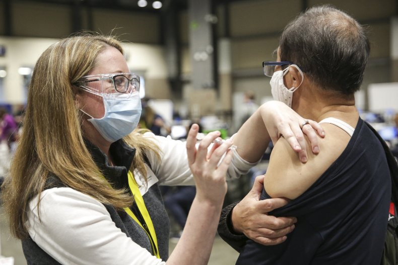 Nurse administers the Pfizer COVID-19 vaccine
