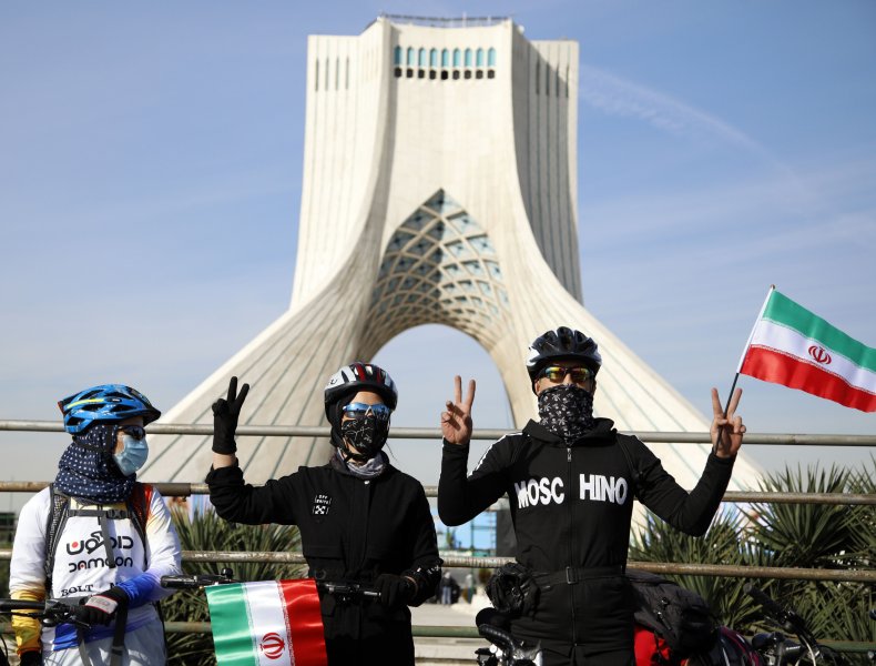 Iranians with flags in Tehran Revolution Day