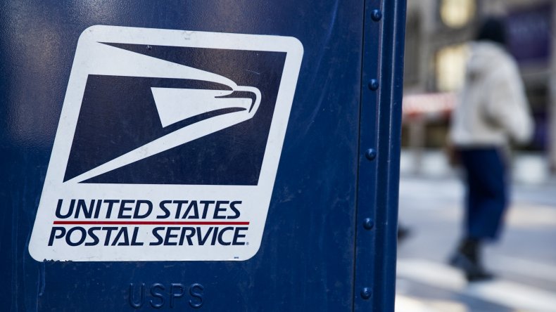 A USPS logo on mailbox