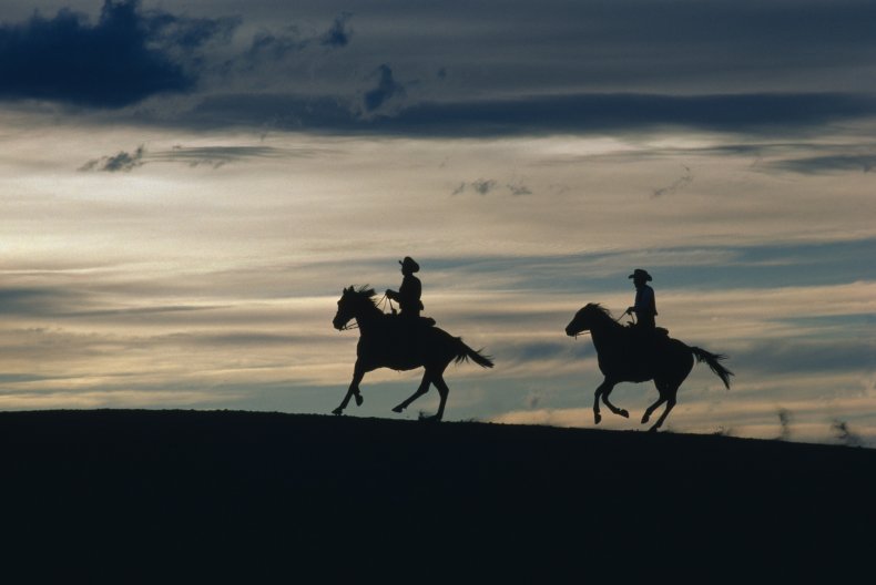 Cowboys at dusk in New Mexico