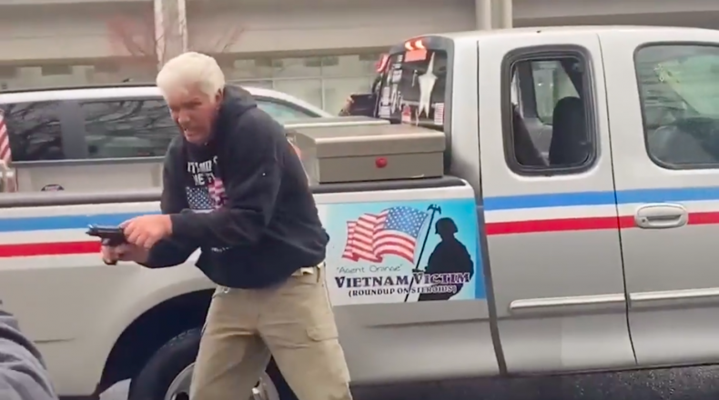 Right-wing demonstrator with gun