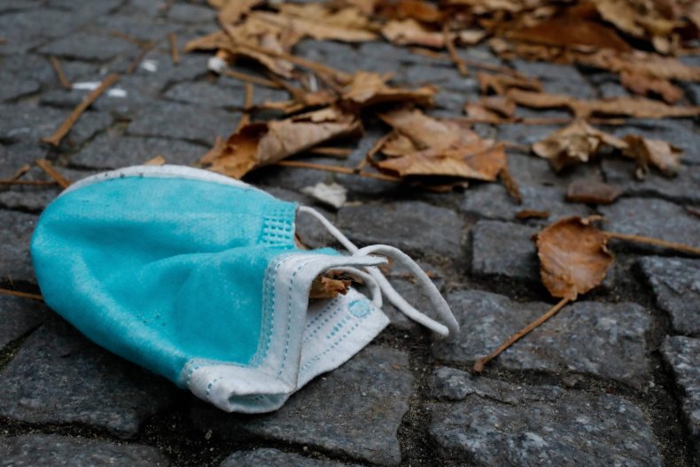 Mask On Ground With Leaves