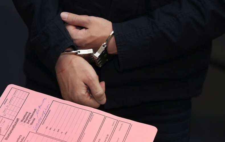 File photo showing handcuffs in court