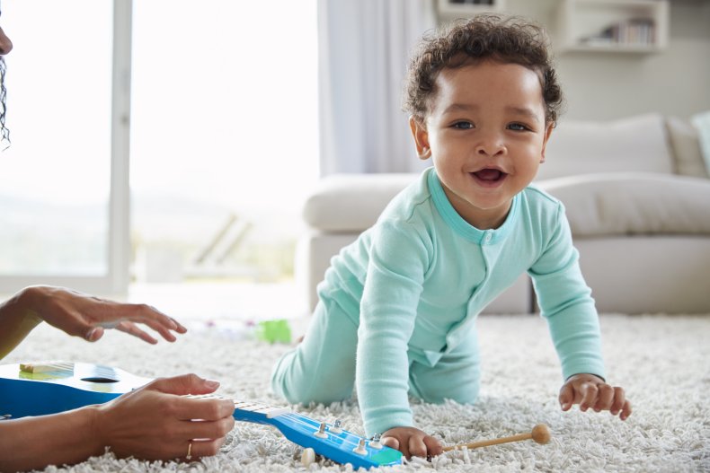 Baby crawling with mom