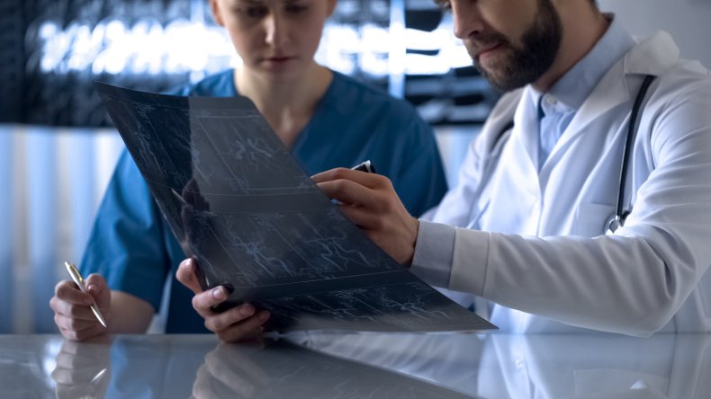 Doctors looking at scans