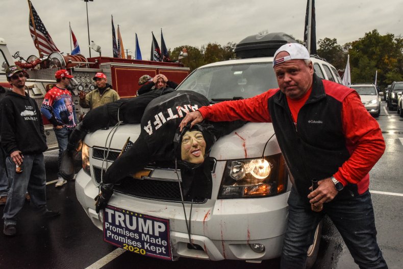 Trump supporter with an Antifa effigy