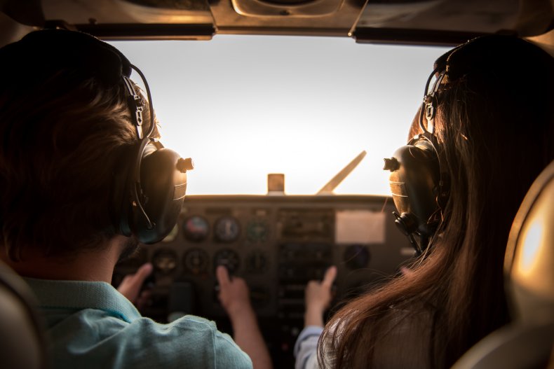 Image of a couple flying a plane