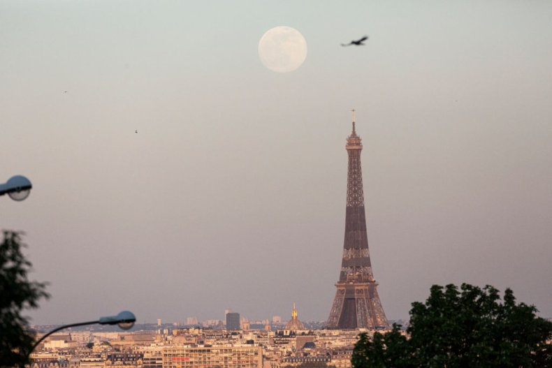 Pink moon rises above Paris' Eiffel Tower