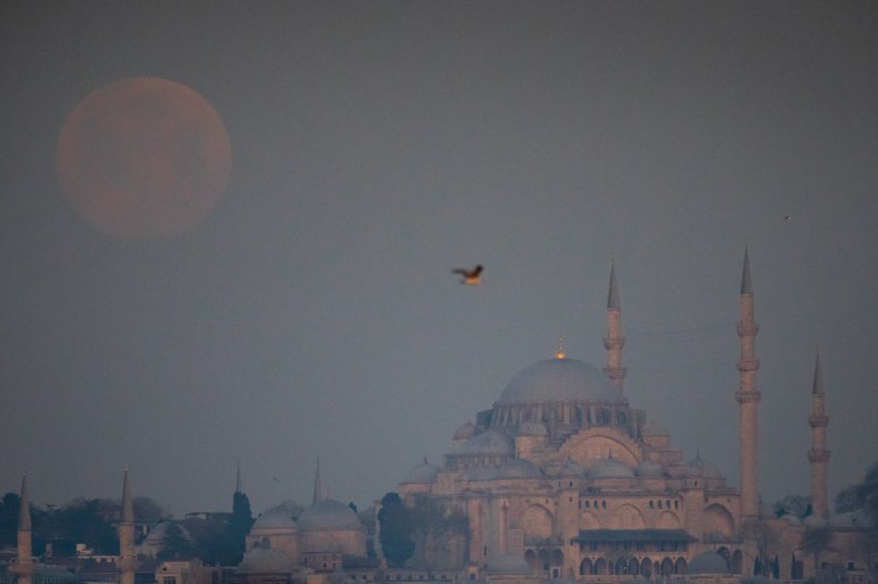 Pink moon above Suleymaniye Mosque in Istanbul