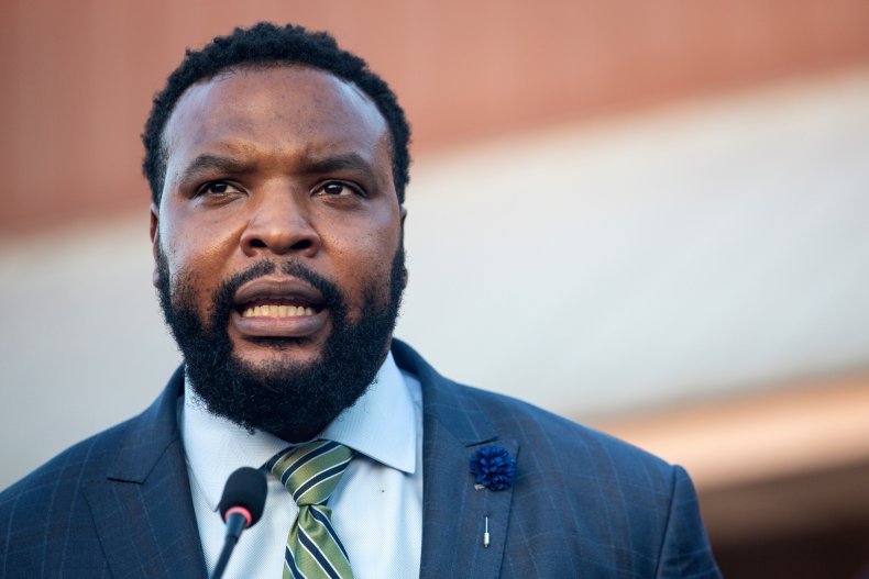 Attorney Lee Merritt speaks at vigil