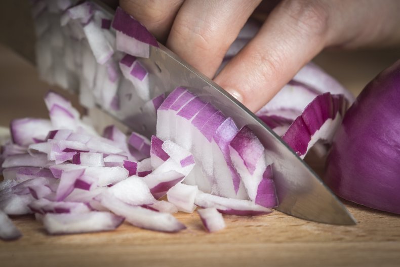 chopping onions on board