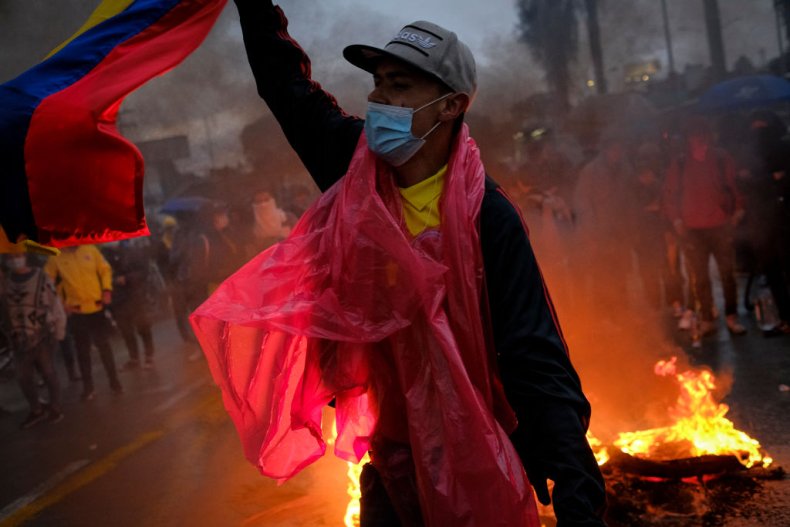 Protester wearing Colombia flag amid unrest