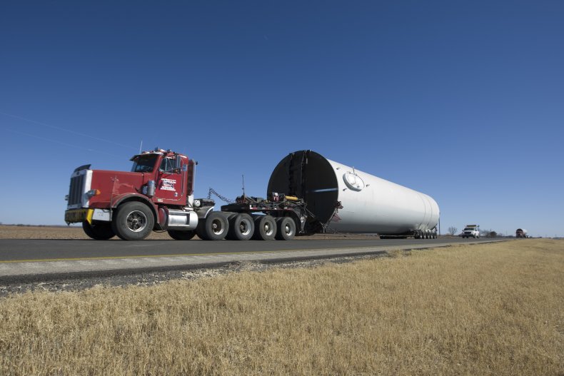 Trucks pulling windwill parts in Texas 