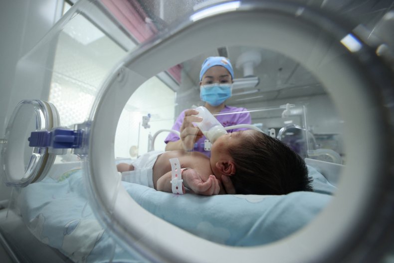 China Nurse Feeds Newborn Baby