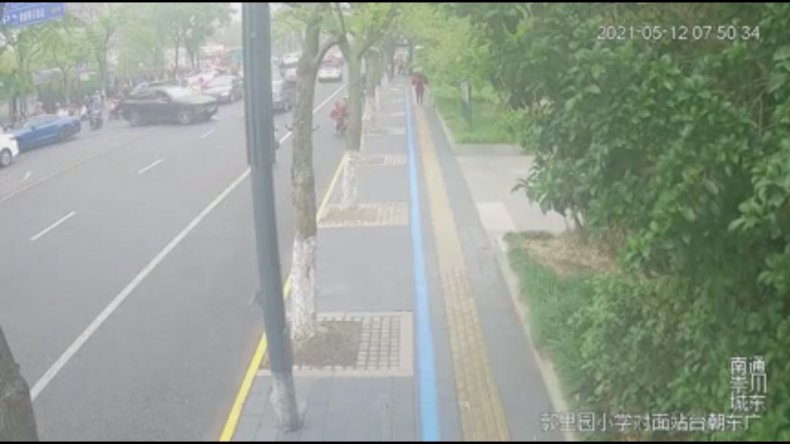 Driver Rams Traffic Cop Along Road