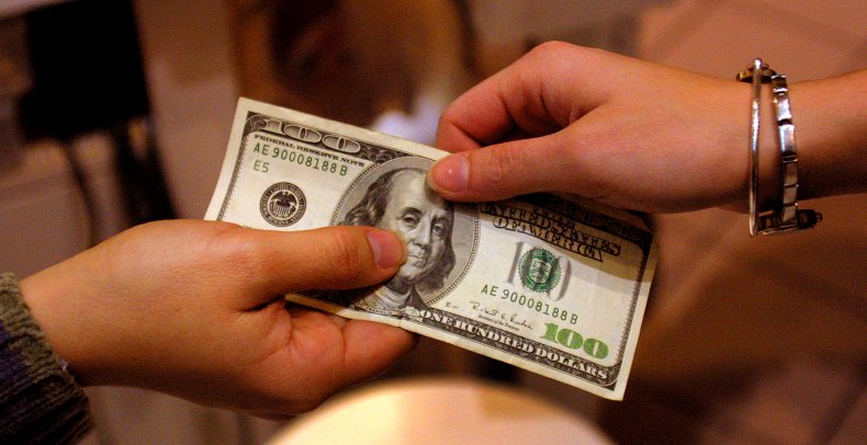A Shopper Pays with a $100 Bill