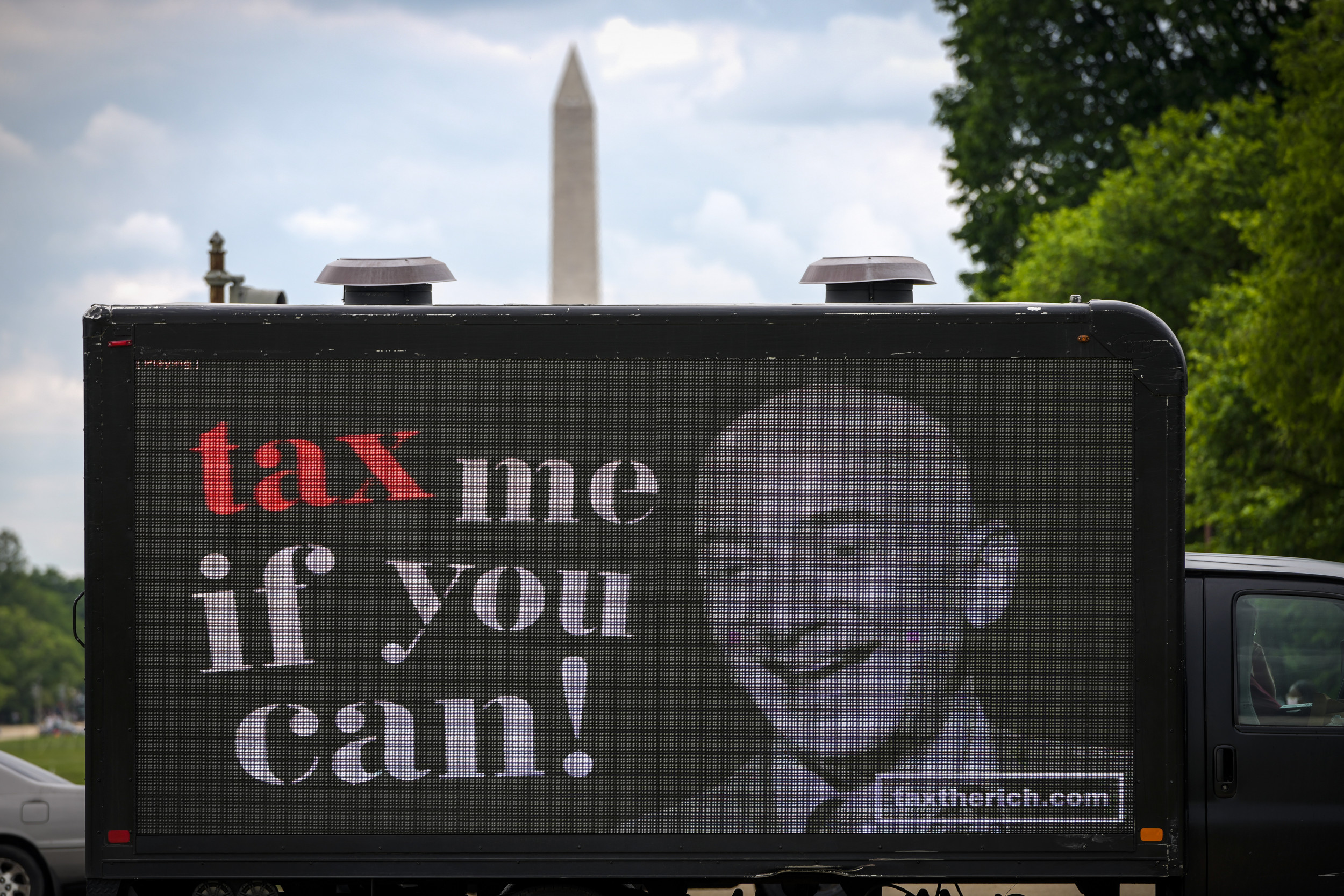 Millionaires Protest Outside Jeff Bezos' House: 'Cut the Bulls**t. Tax