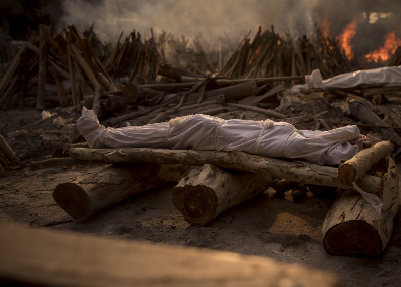 Father carries the body of the dead daughter