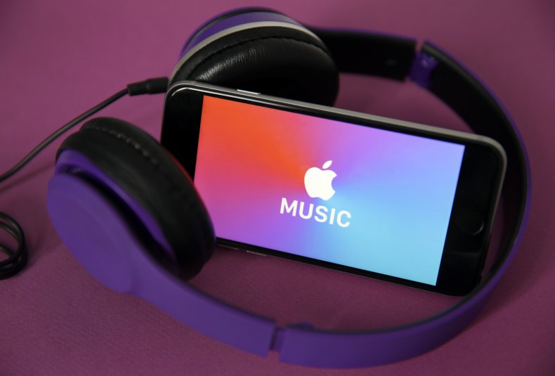 Apple Music on an iPhone with headphones