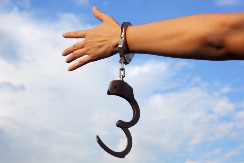 A hand freed from handcuffs