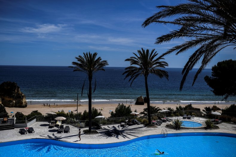 Woman confronts 'laughing' men at pool