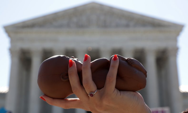 Pro-Life Activist Holds Model Fetus
