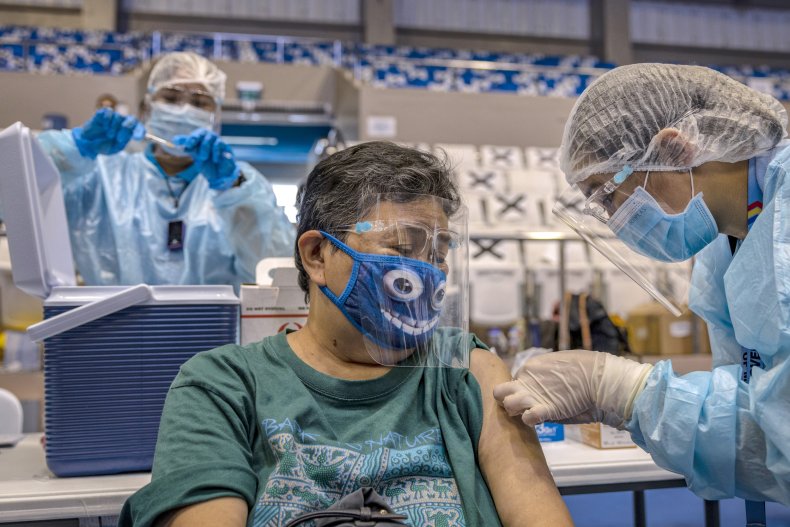 Woman Administered COVID-19 Vaccine in the Philippines