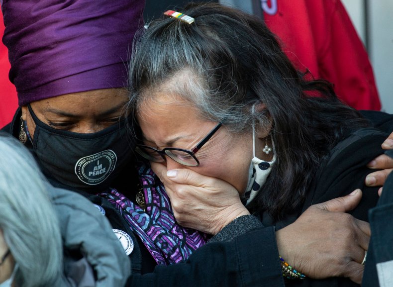 A woman cries at anti-Asian hate rally.