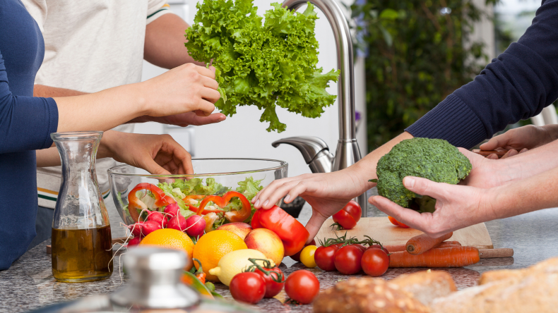 Friends making salad