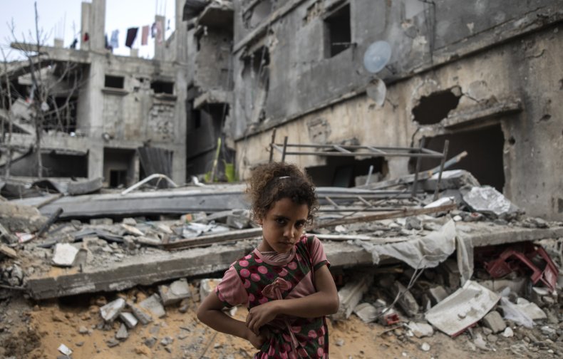 Girl In Front Of Crumbled Home, Israel-Palestine