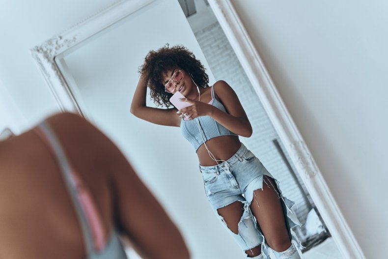 woman taking selfie in the mirror 