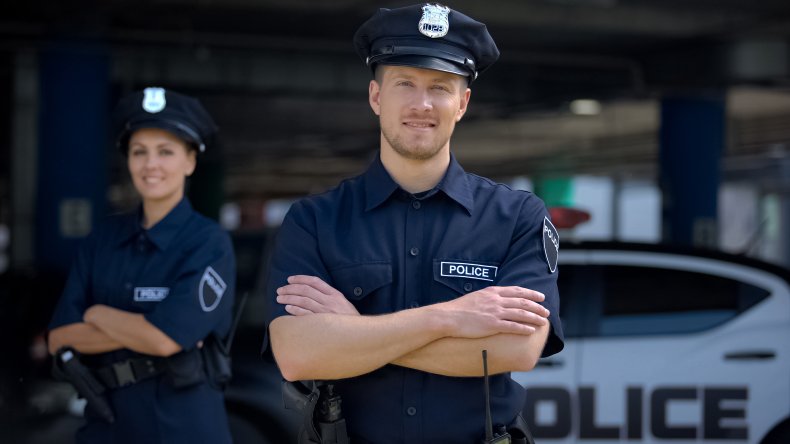 A police officer smiling