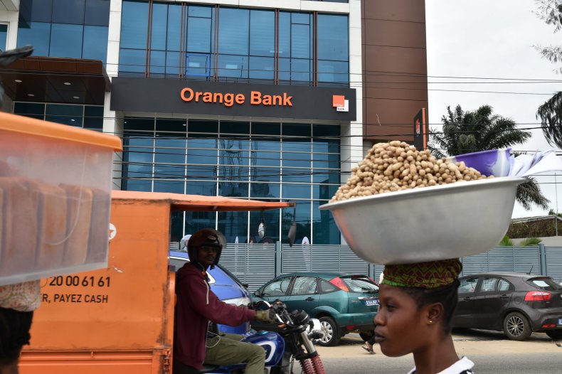People walks past the Orange Bank