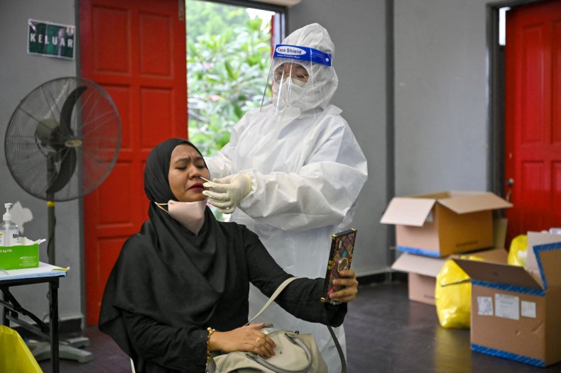 Woman Takes Selfie While Testing For Covid