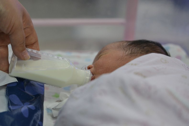 Medical Staff Member Feeds Baby in China