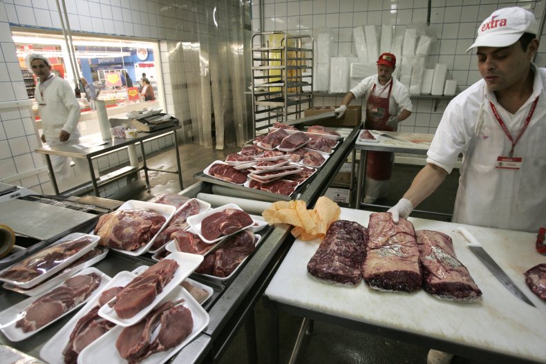 JBS employees prepare beef