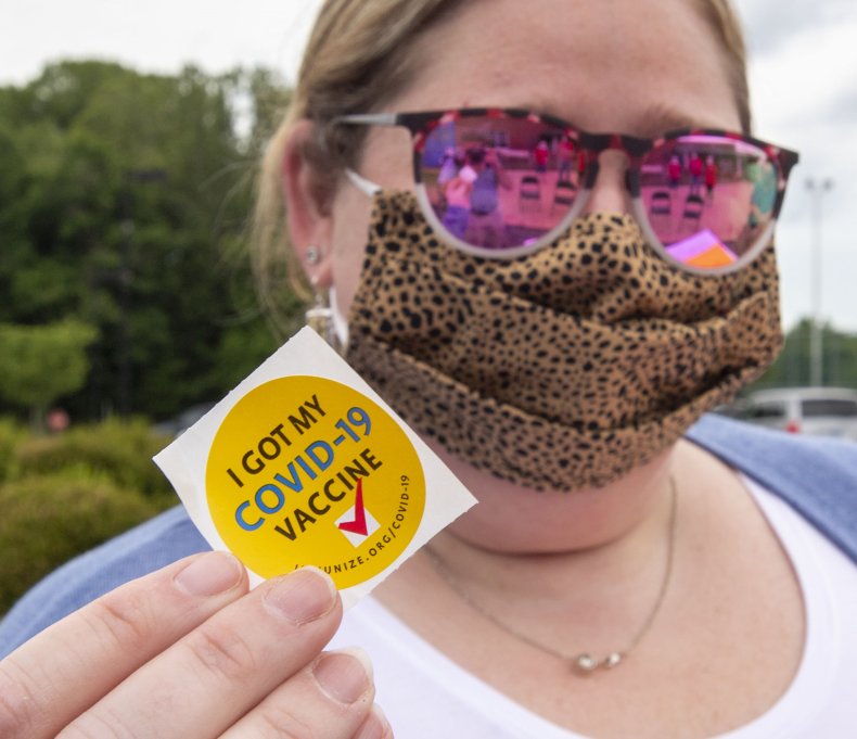 Woman Shows Off "COVID-19 Vaccine" Sticker