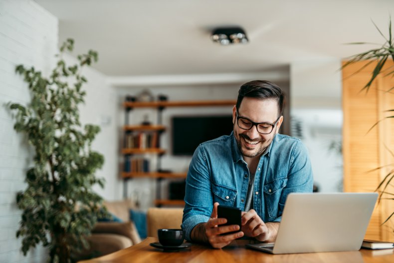 Man smiling with phone