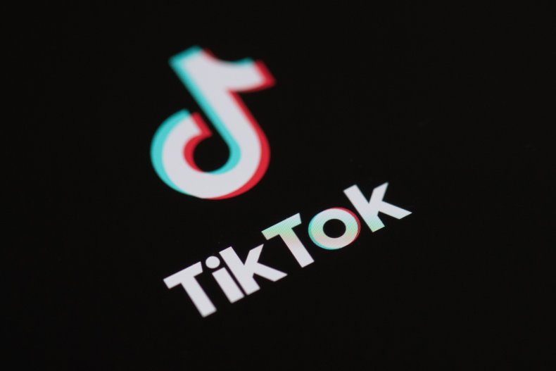 TikTok logo against black screen