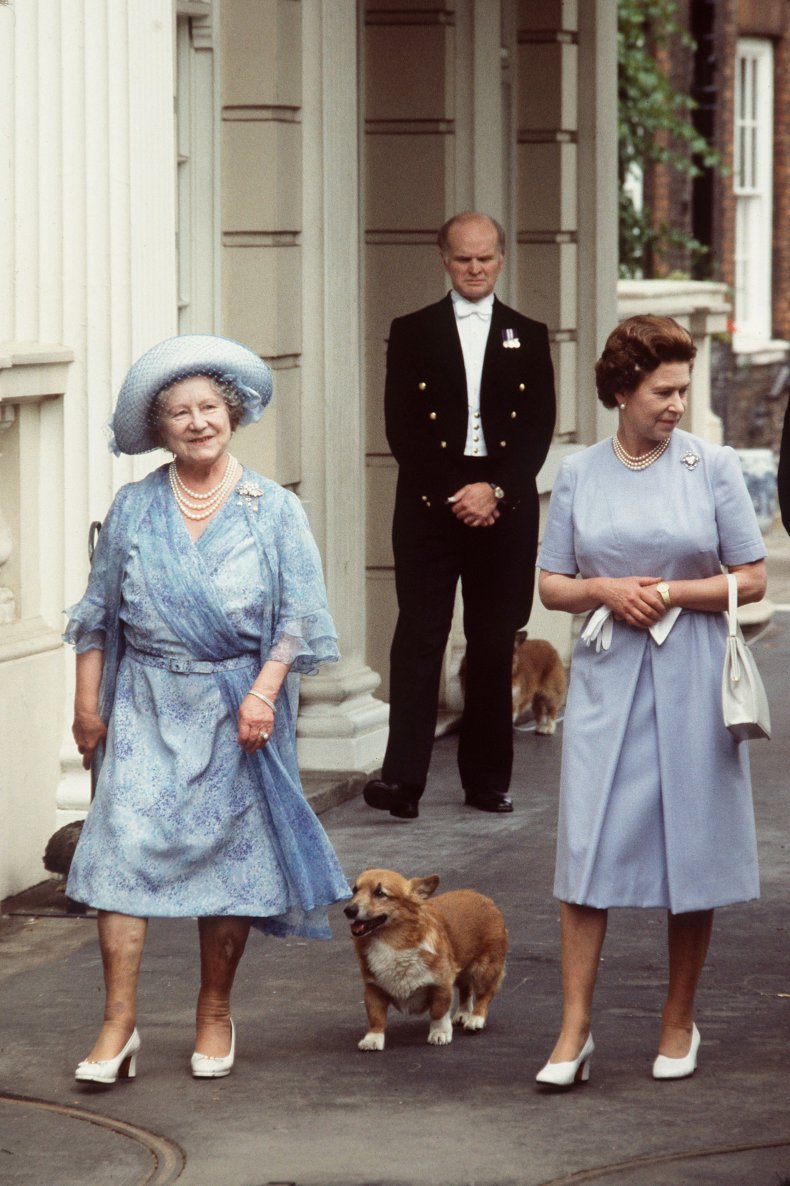 Queen Elizabeth and Queen Mother Walk Dog