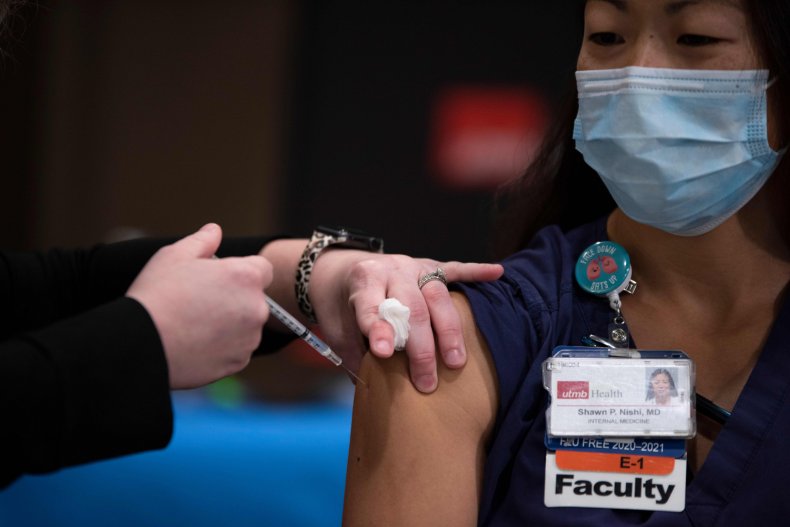 A doctor getting vaccinated in Texas.
