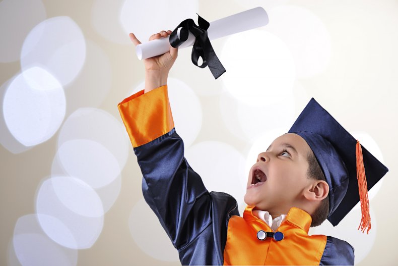 Boy on graduation wearing gown and cap